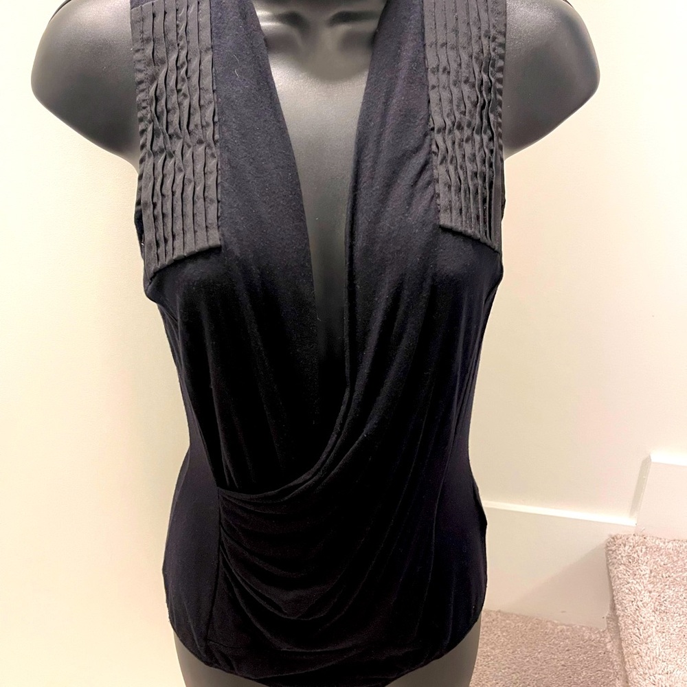 Woman’s BEBE Low low cut Tank, Size XS, True black in colour